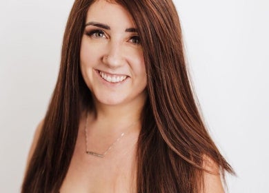 Smiling person at CURA, a beauty and wellness venue in Trail, British Columbia, CA.