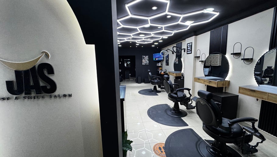 Chic interior of Just A Smile Salon in Doha, Doha Municipality, QA showcasing modern styling chairs and mirrors.