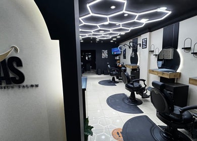 Chic interior of Just A Smile Salon in Doha, Doha Municipality, QA showcasing modern styling chairs and mirrors.