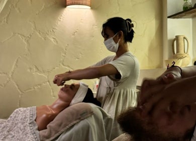 Clients enjoy facial treatments at Face Therapy Spa, Umalas in Bali, ID, showcasing a calming wellness experience.