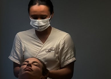 Therapist providing a soothing facial massage at Face Therapy Spa, Umalas, Bali, ID.