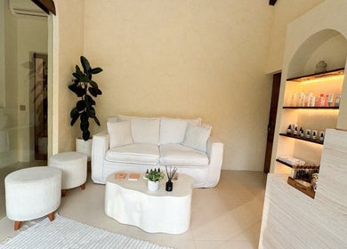 Tranquil lounge at Face Therapy Spa, Umalas, Bali, ID, showcasing cozy seating and soothing decor.
