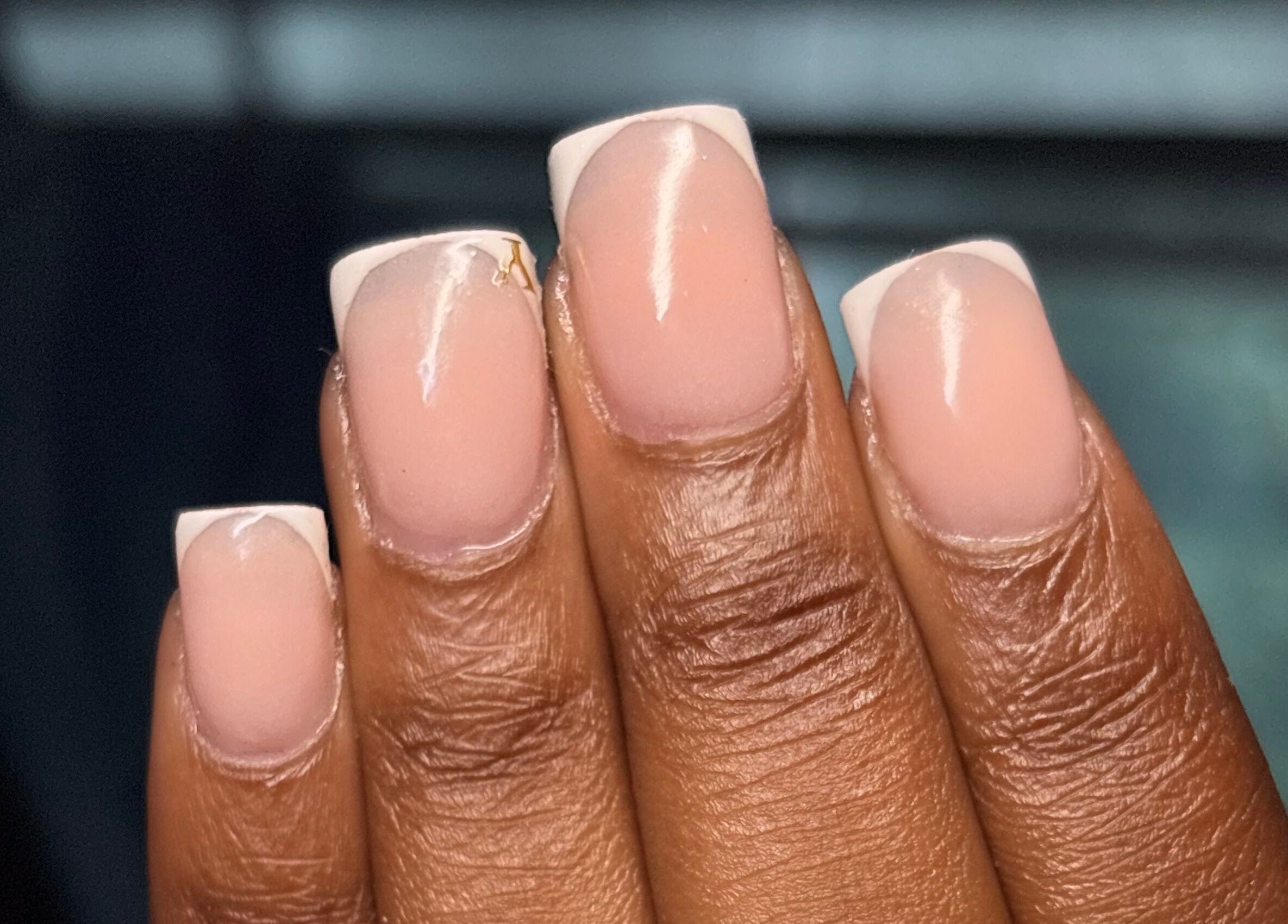 Elegant French manicure at Thee Adore Beauty Bar, London, England, GB. Showcase perfect nail styling.