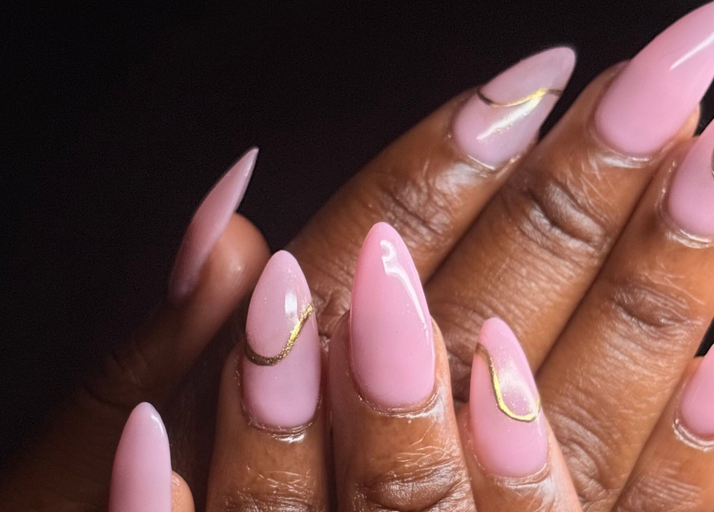 Styled pink nails with gold accents at Thee Adore Beauty Bar, London, England, GB.