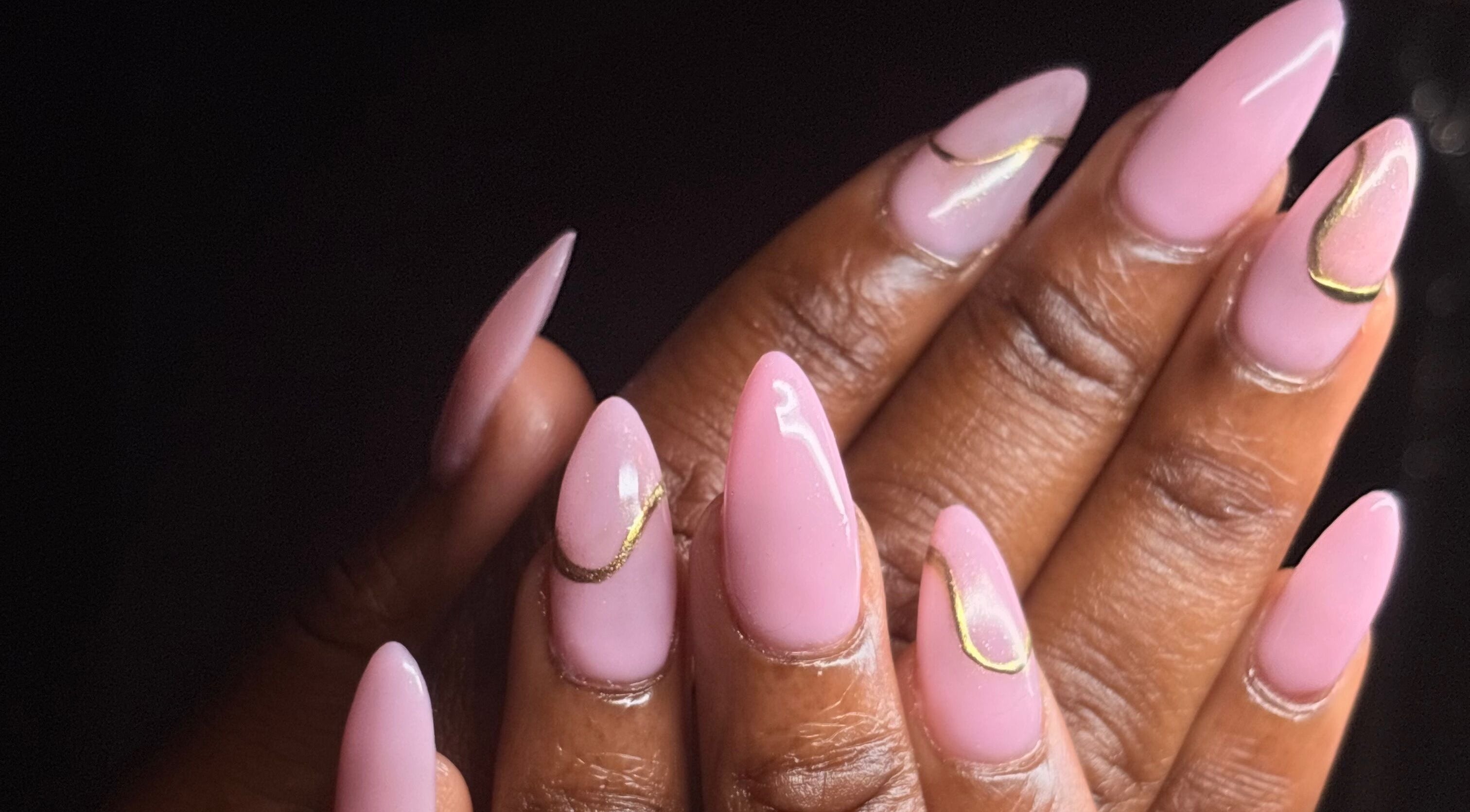 Styled pink nails with gold accents at Thee Adore Beauty Bar, London, England, GB.