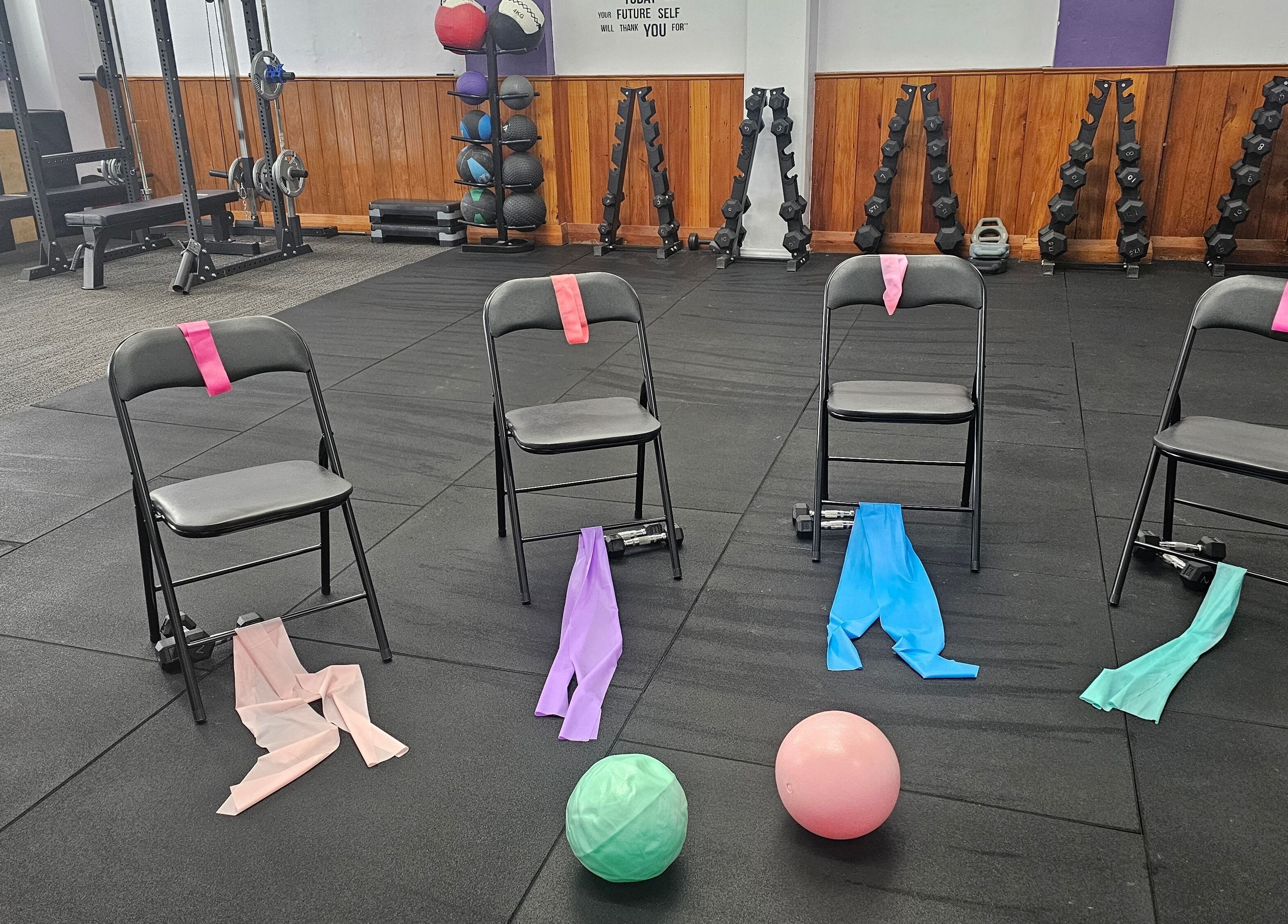 Exercise setup at Let's Get Fizzical, Dannevirke, Manawatū-whanganui, NZ featuring chairs with resistance bands.
