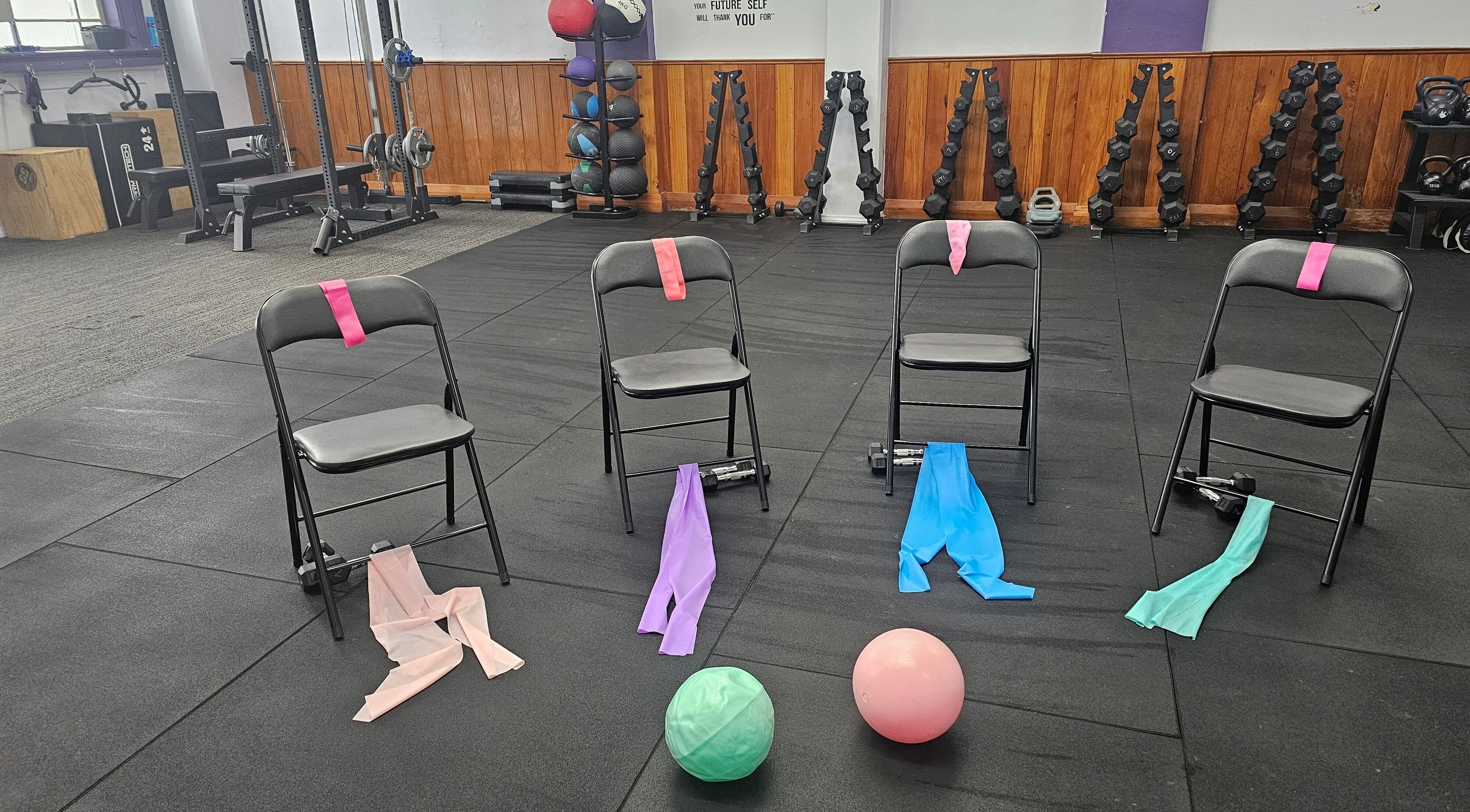 Exercise setup at Let's Get Fizzical, Dannevirke, Manawatū-whanganui, NZ featuring chairs with resistance bands.