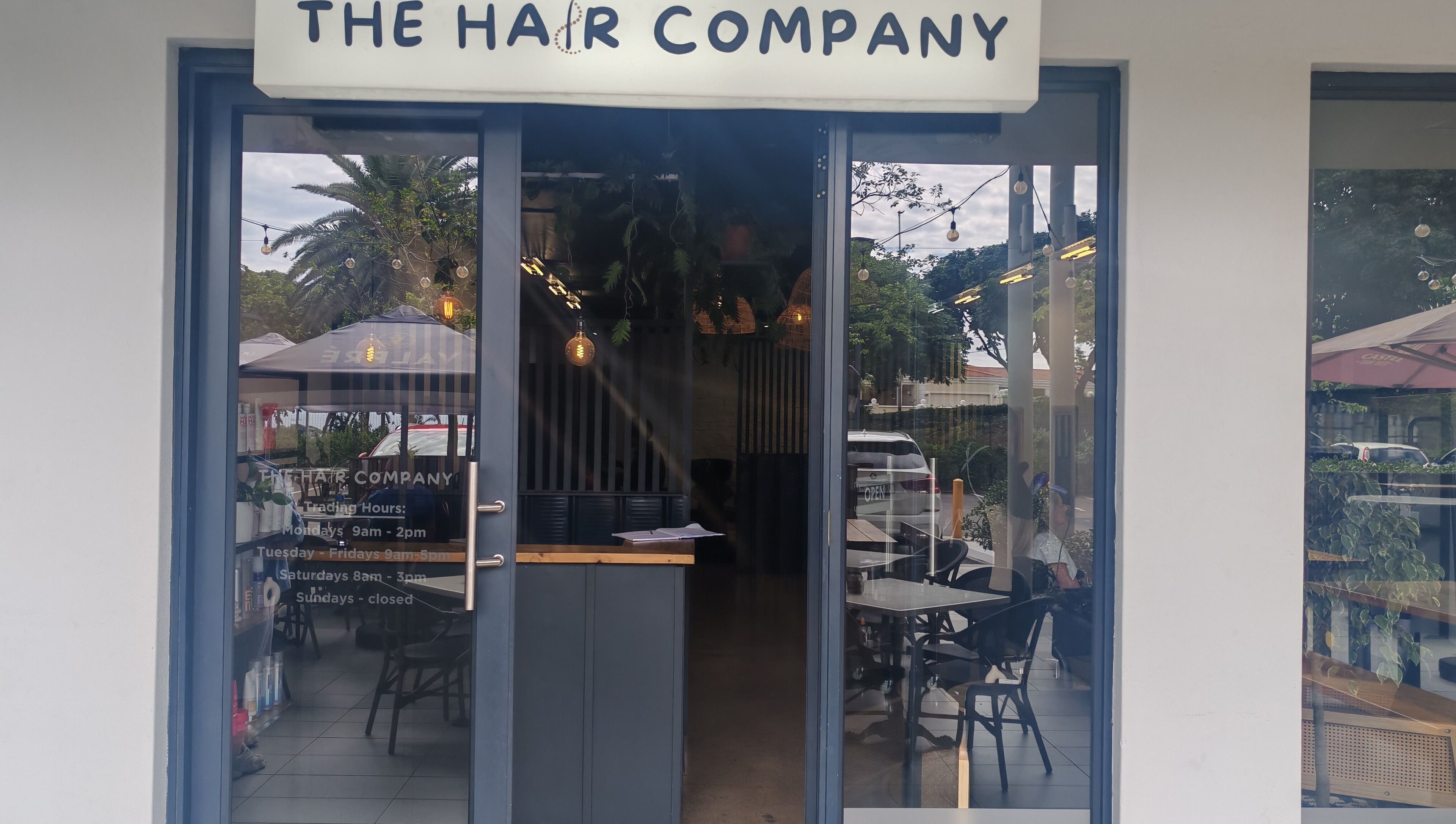 Entrance of Melinda Marx at The Haircompany in Umhlanga, Kwazulu-natal, ZA featuring chic interior.
