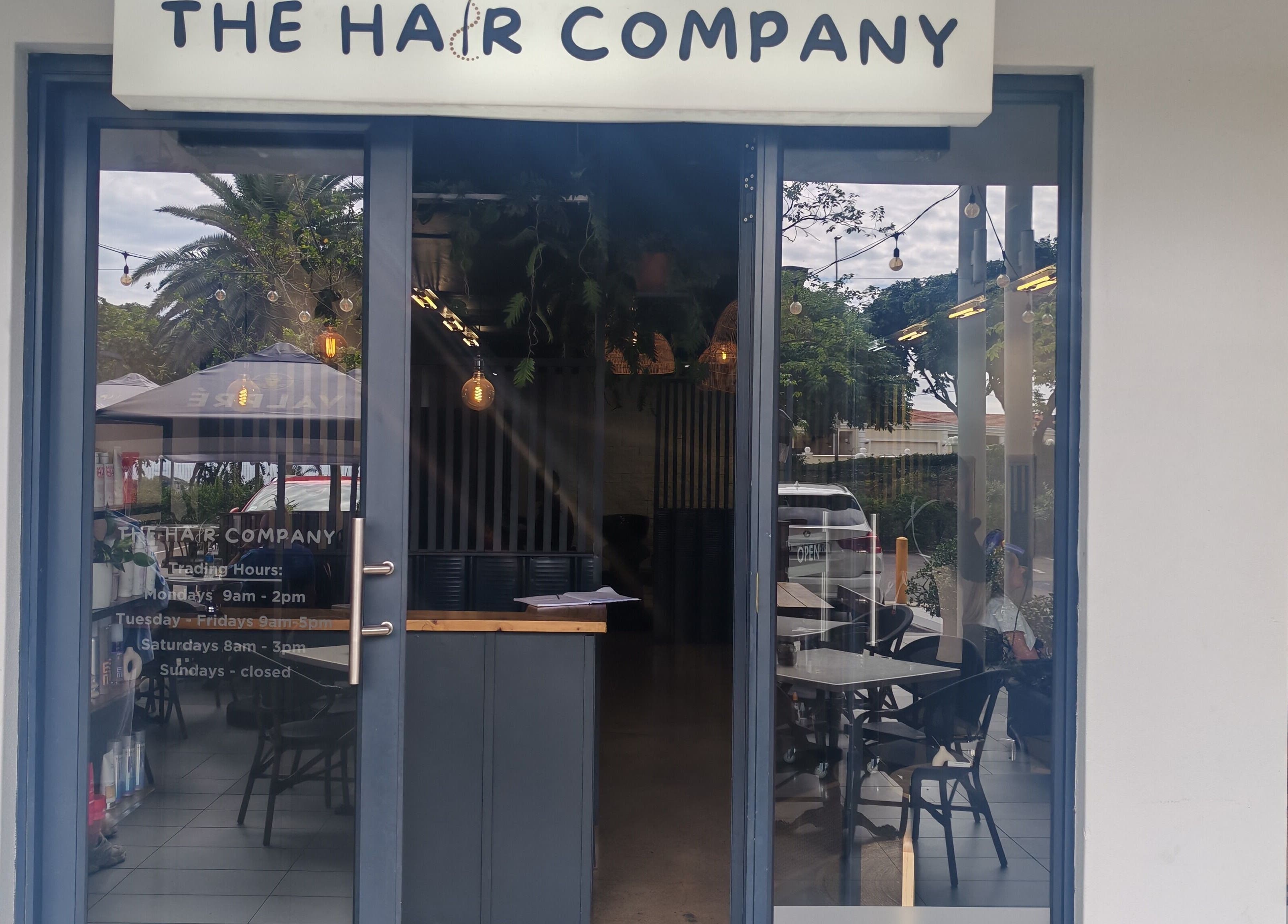 Entrance of Melinda Marx at The Haircompany in Umhlanga, Kwazulu-natal, ZA featuring chic interior.
