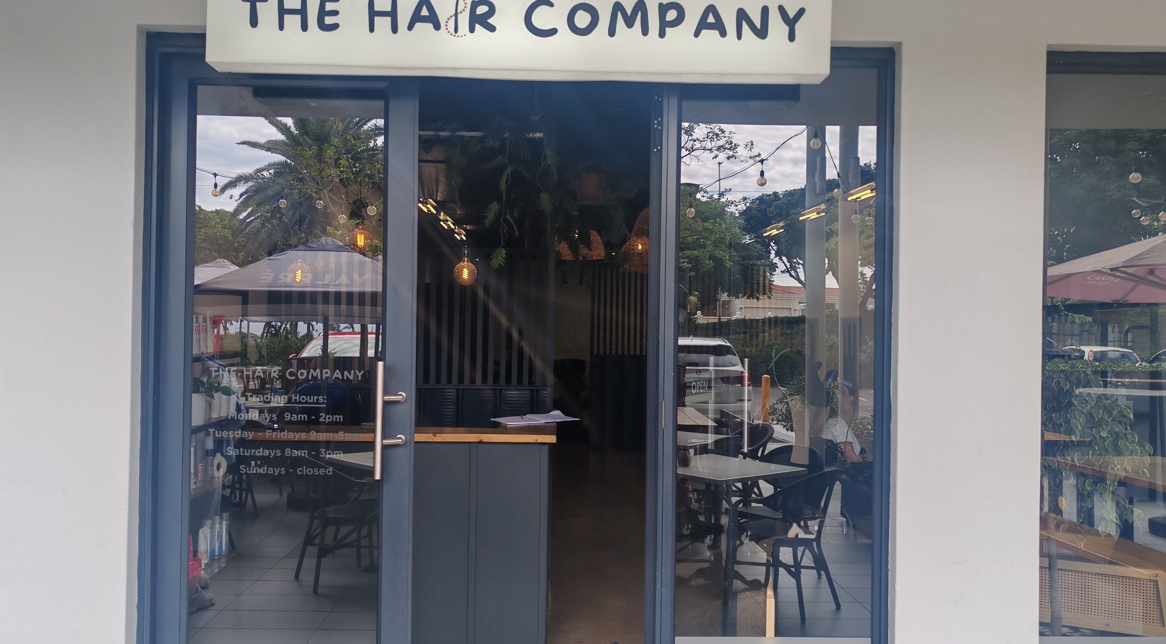 Entrance of Melinda Marx at The Haircompany in Umhlanga, Kwazulu-natal, ZA featuring chic interior.
