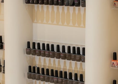 Nail polish display at Vianne Spa, Muscat, showcasing diverse colors. Luxury beauty in Muscat Governorate, OM.