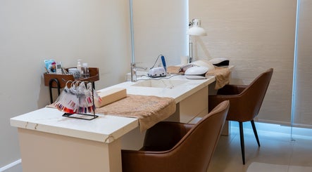 Manicure station at Vianne Spa, Muscat, with luxury seats and nail care tools.