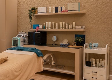 Elegant treatment room at Vianne Spa, Muscat, featuring skincare products and cozy ambiance.