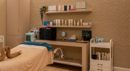 Elegant treatment room at Vianne Spa, Muscat, featuring skincare products and cozy ambiance.