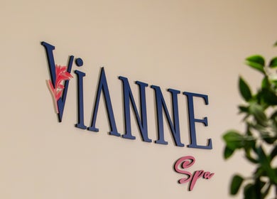 Entrance sign at Vianne Spa, Muscat, Muscat Governorate, OM surrounded by greenery.
