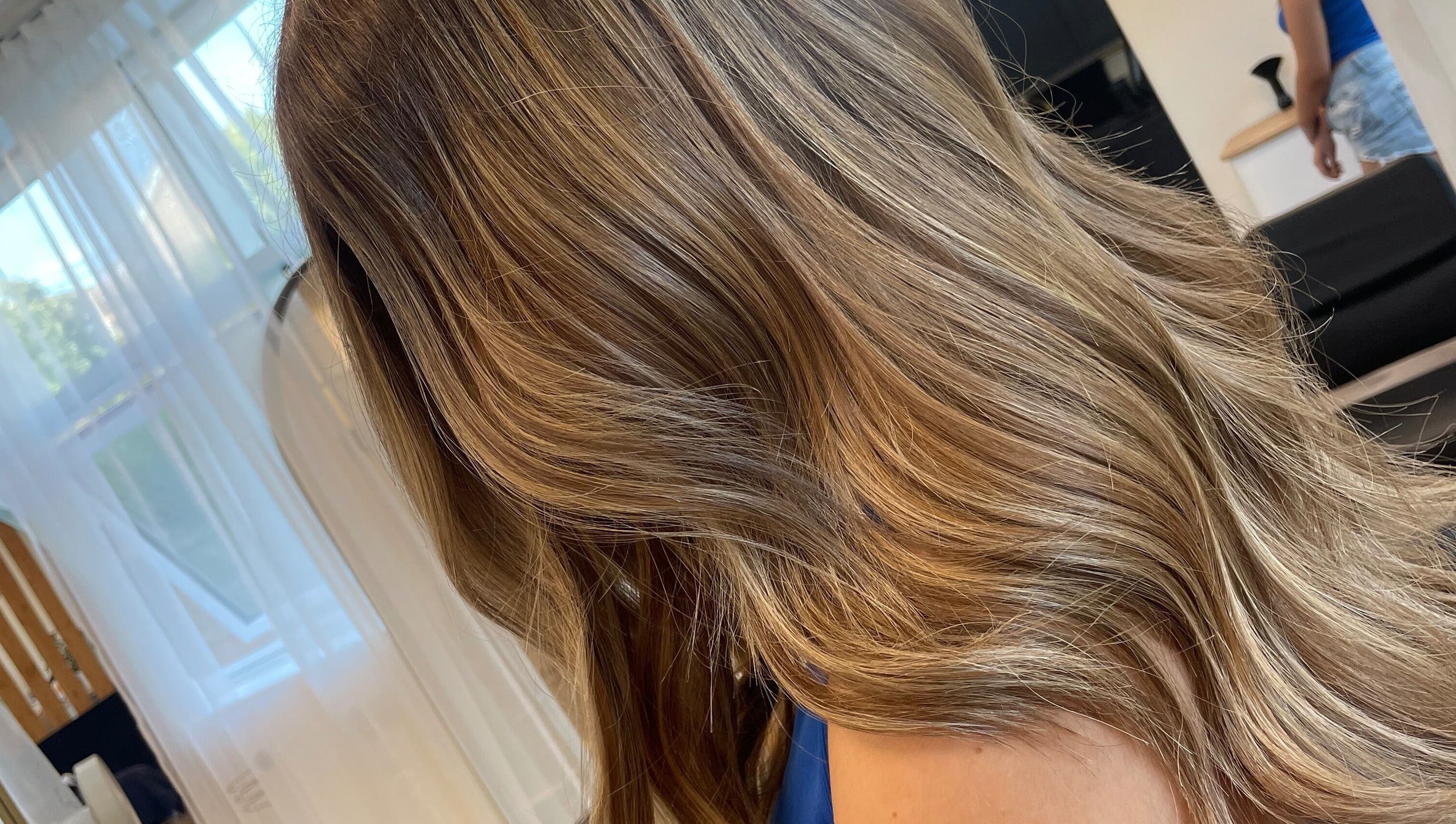 Elegant blonde hair at Alice Tobin Hair Design in Cardiff, Wales, GB, showcasing expert hairstyling.