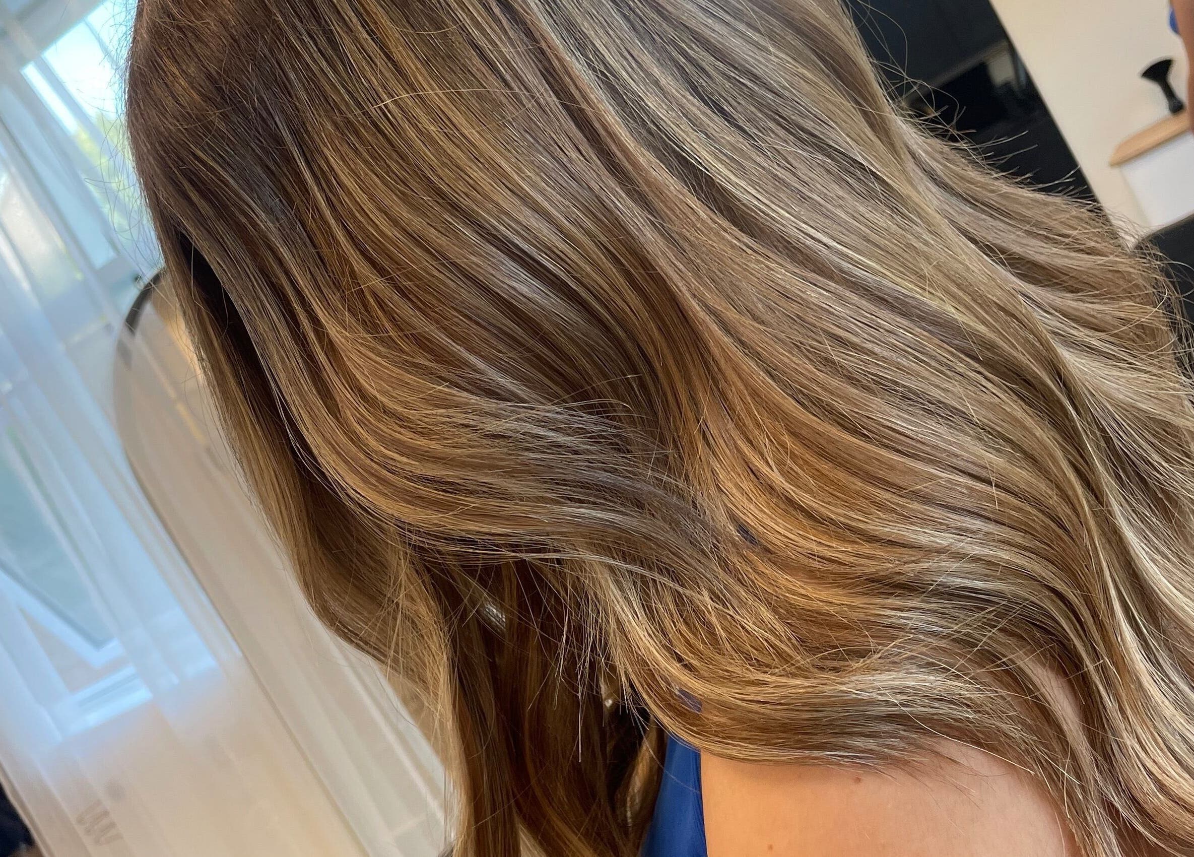 Elegant blonde hair at Alice Tobin Hair Design in Cardiff, Wales, GB, showcasing expert hairstyling.