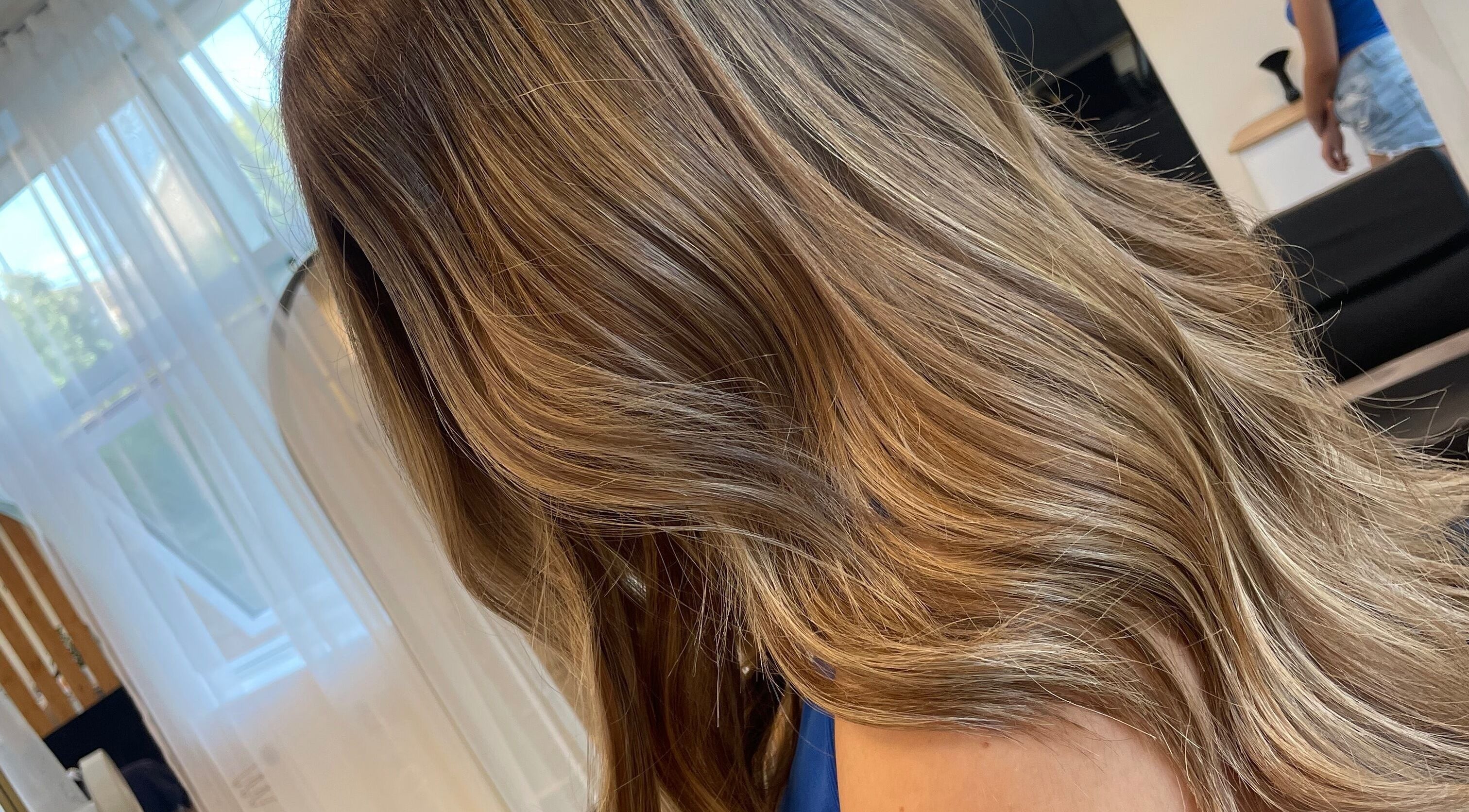 Elegant blonde hair at Alice Tobin Hair Design in Cardiff, Wales, GB, showcasing expert hairstyling.