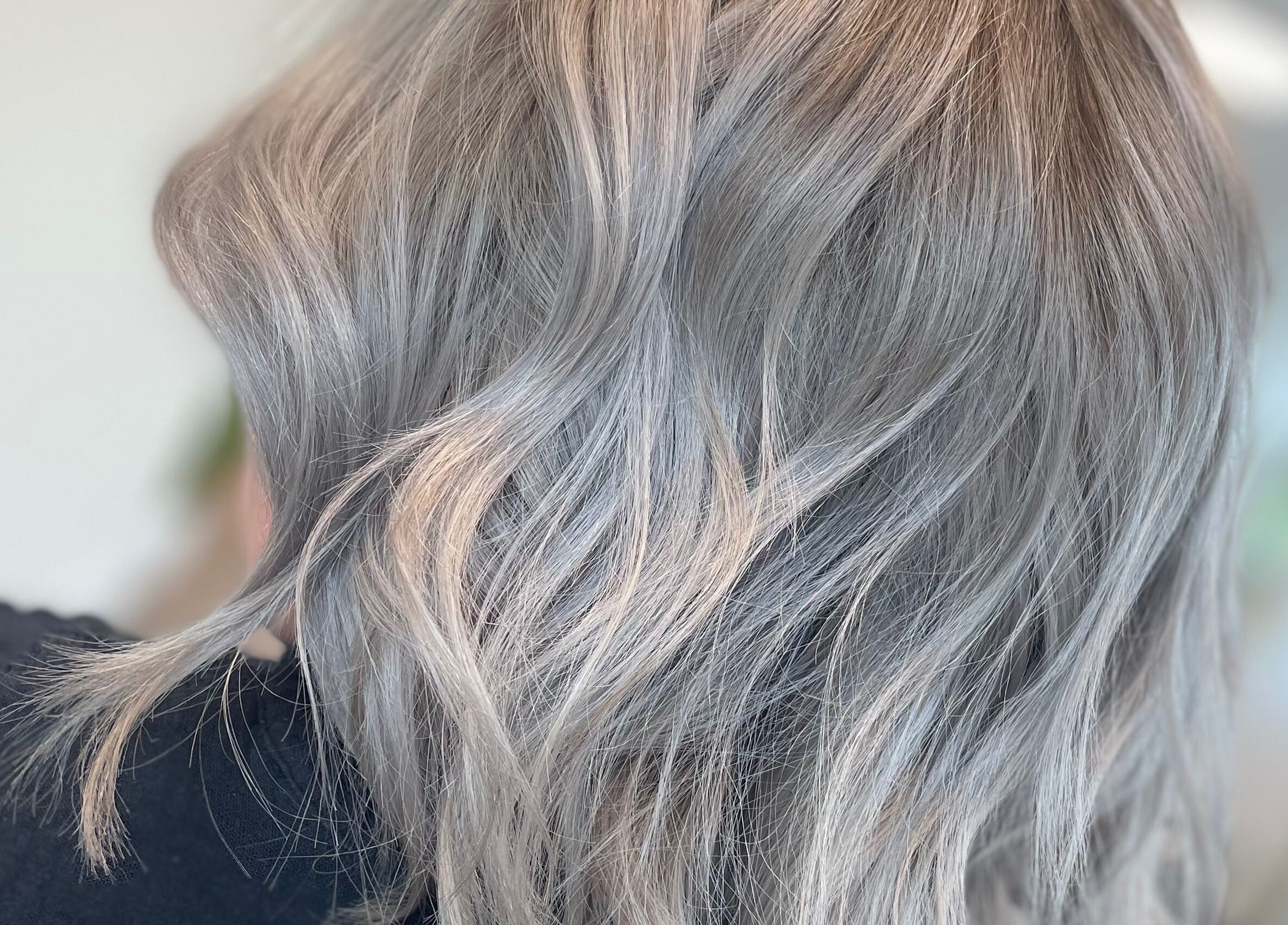 Elegant silver hair styled at Alice Tobin Hair Design, Cardiff, Wales, GB.