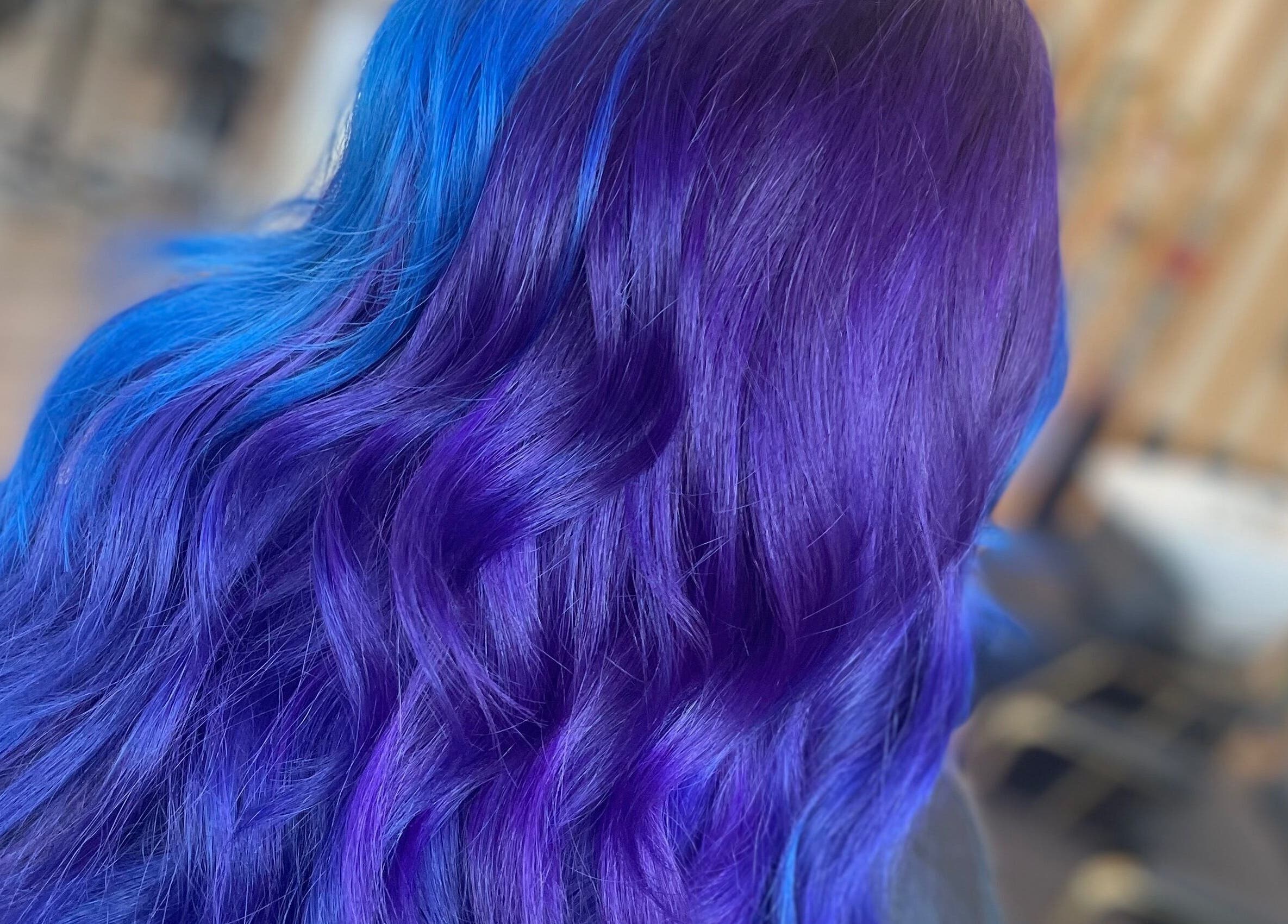Vibrant purple and blue hair at Alice Tobin Hair Design, Cardiff, Wales, GB. Expertly styled for a modern look.