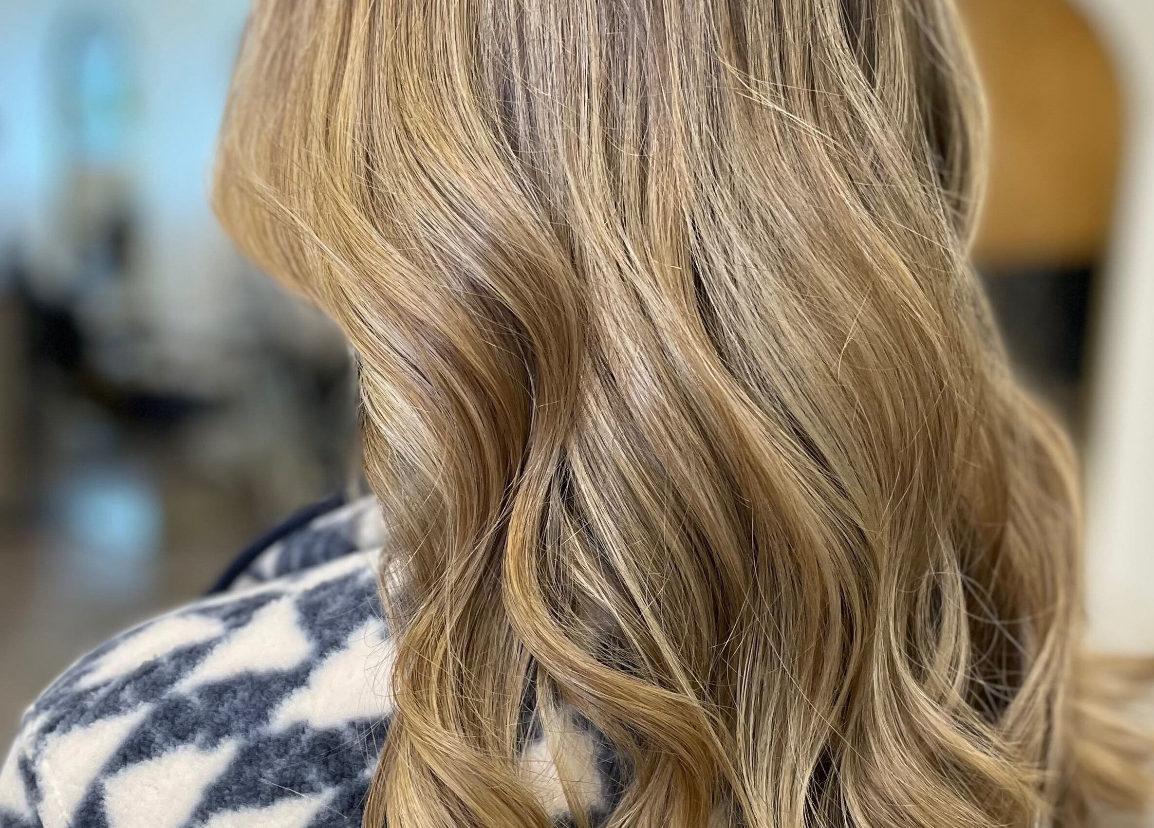 Stylish wavy blonde hair at Alice Tobin Hair Design, Cardiff, Wales, GB.