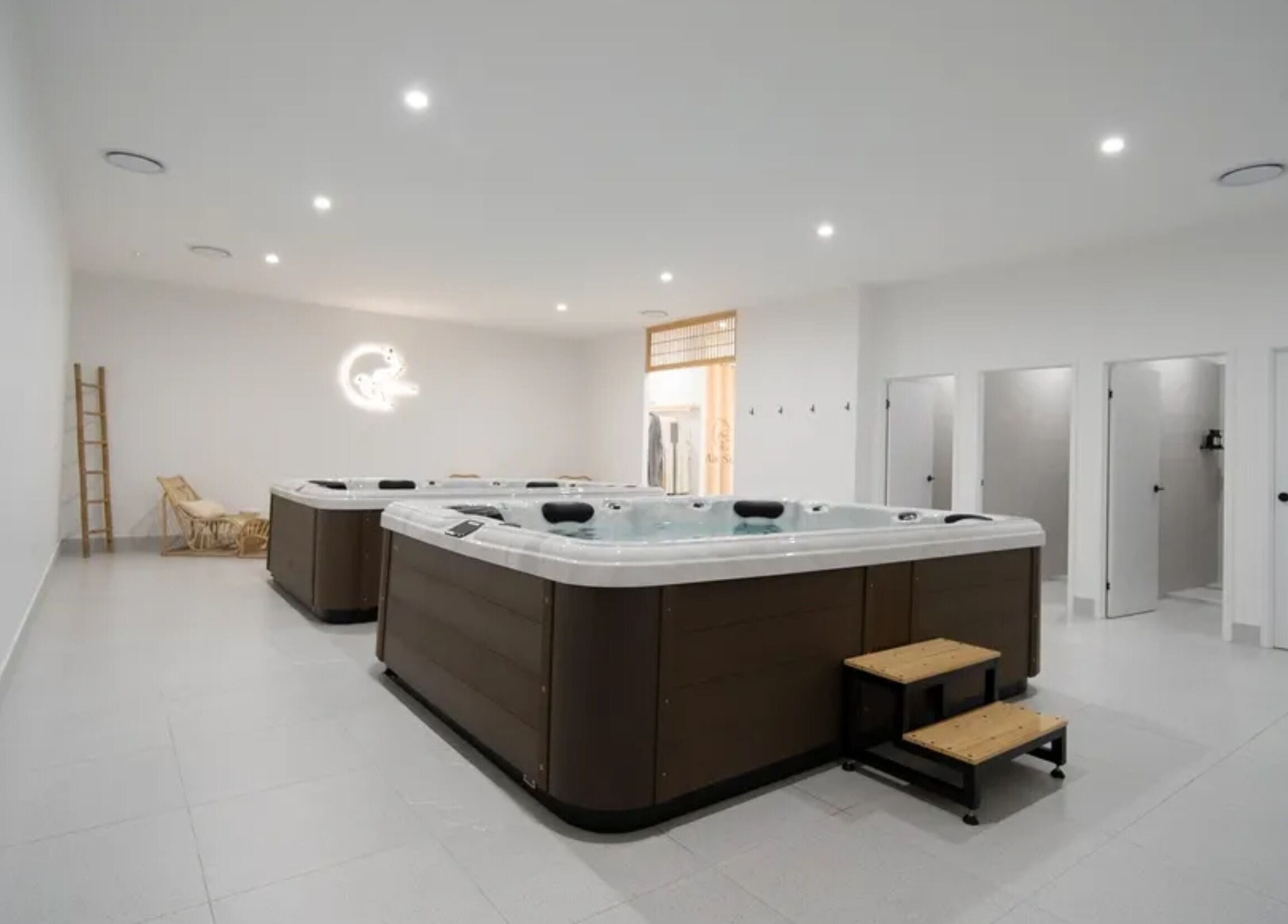 Luxurious hot tubs at Mada Sora Spa, Rural View, Queensland, AU, offering a relaxing wellness experience.