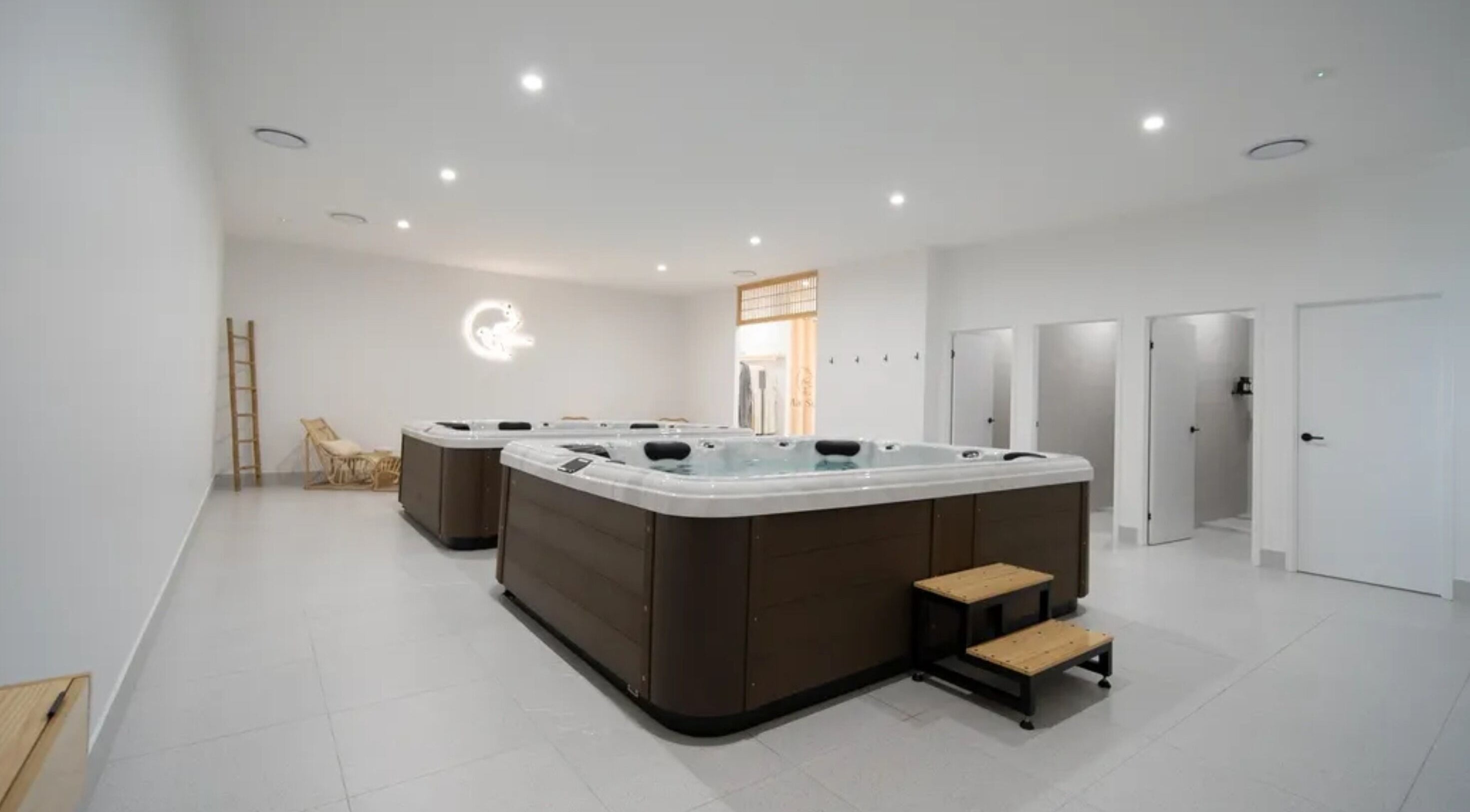 Luxurious hot tubs at Mada Sora Spa, Rural View, Queensland, AU, offering a relaxing wellness experience.