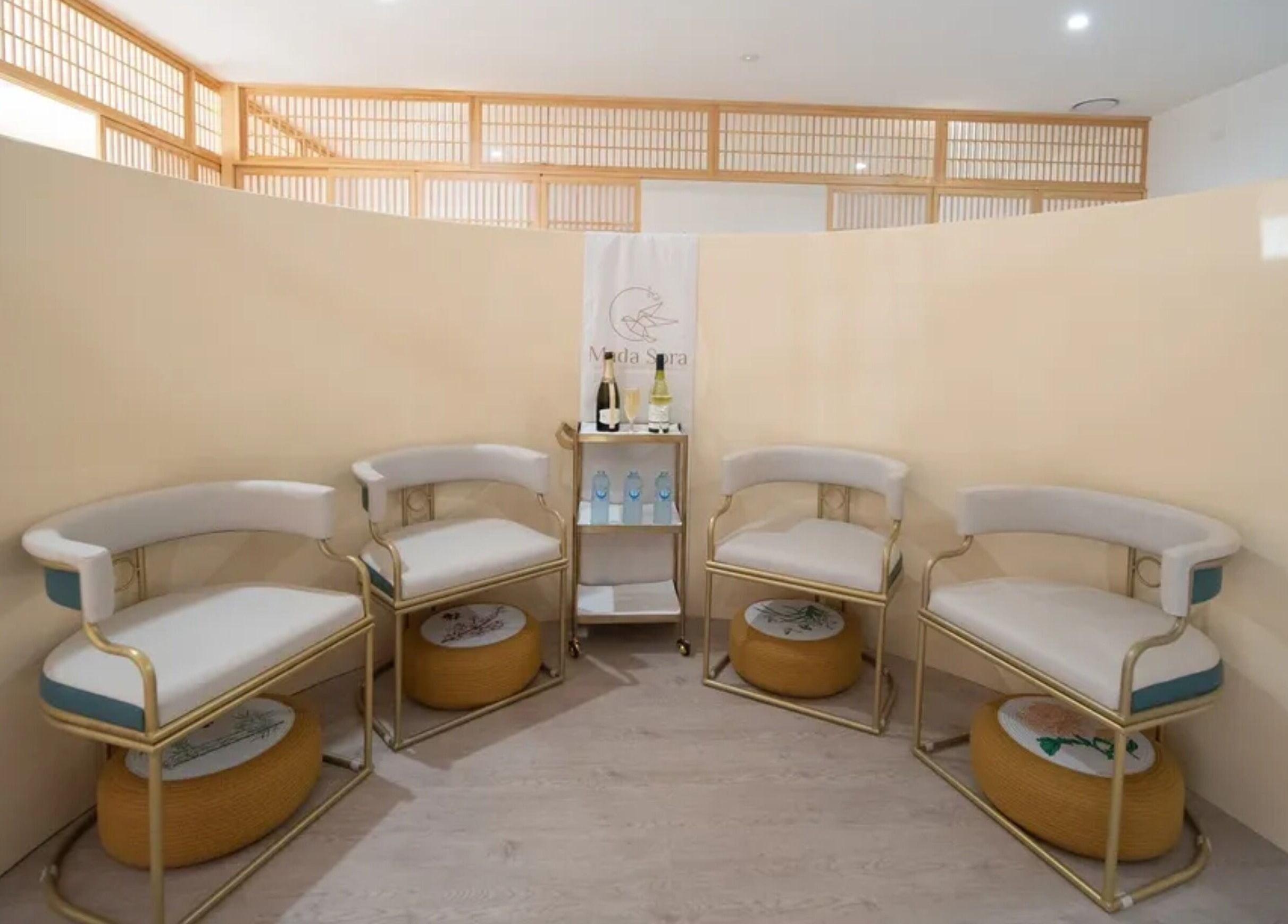 Elegant seating area at Mada Sora Spa in Rural View, Queensland, AU, featuring chic, comfortable chairs.