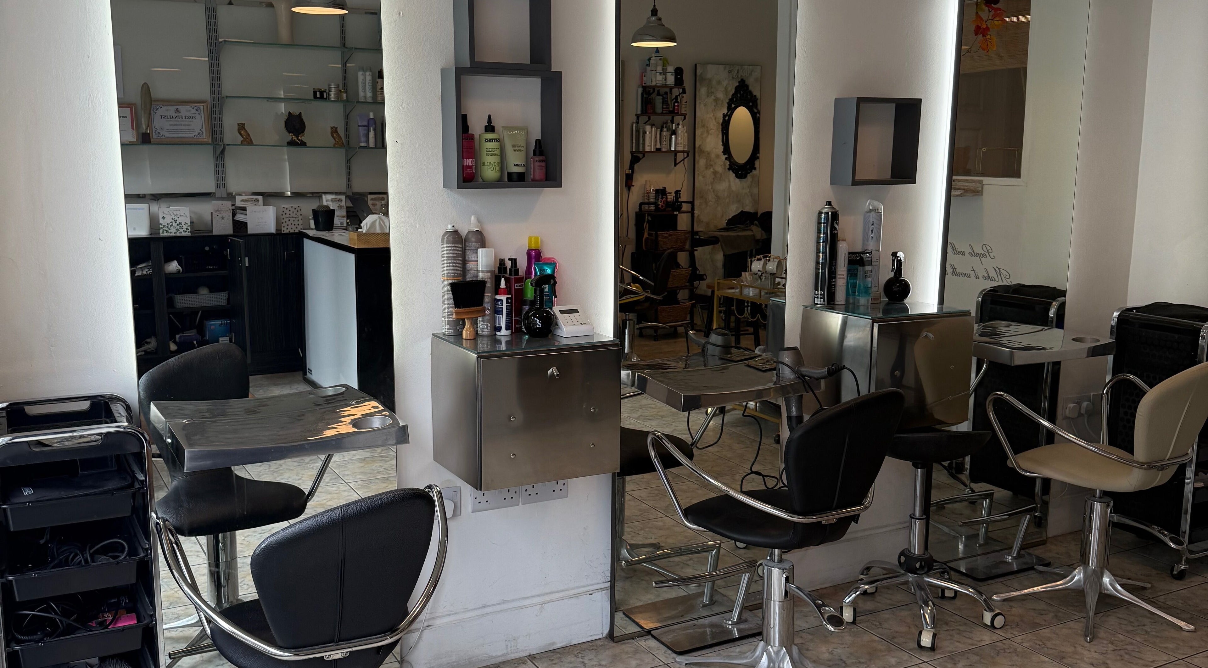 Chic interior of Studio 22 Hairdressing in Stony Stratford, England, GB showcasing sleek styling stations.