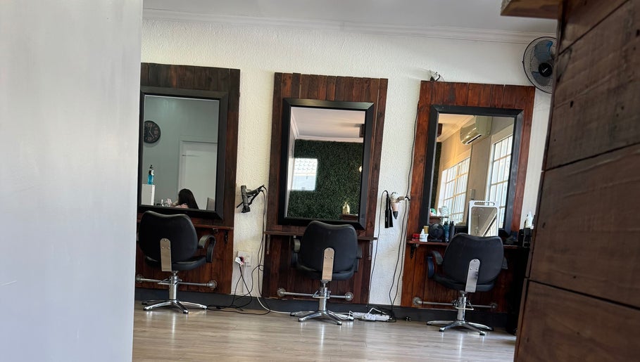 Elegant salon interior with styling stations at The Beauty Room (Heads Up Hair) by Mariska, Pretoria, Gauteng, ZA.