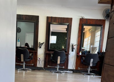 Elegant salon interior with styling stations at The Beauty Room (Heads Up Hair) by Mariska, Pretoria, Gauteng, ZA.