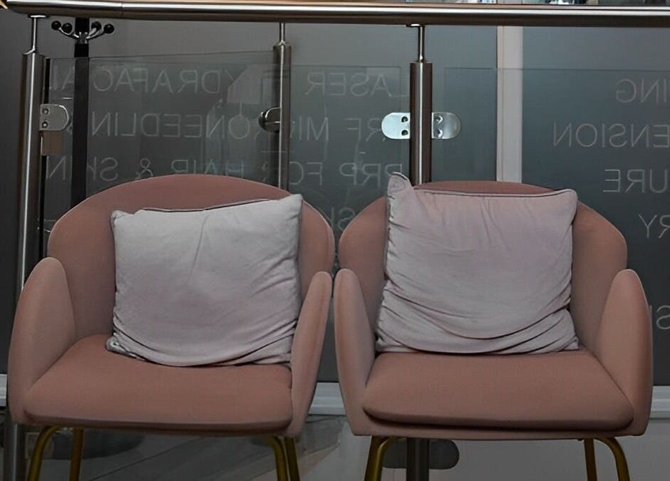 Elegant pink chairs at Patel Sisters Aesthetic Beauty Clinic, London, England, GB create a cozy welcoming space.