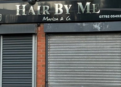 Exterior of a closed salon near The Waxing Room in Pencoed, Wales, GB, featuring a roller shutter.