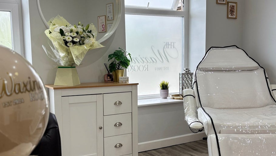 Relaxing treatment room at The Waxing Room in Pencoed, Wales, GB featuring elegant decor and spa chair.