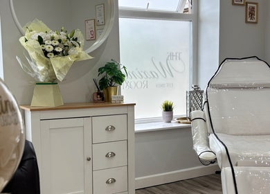 Relaxing treatment room at The Waxing Room in Pencoed, Wales, GB featuring elegant decor and spa chair.