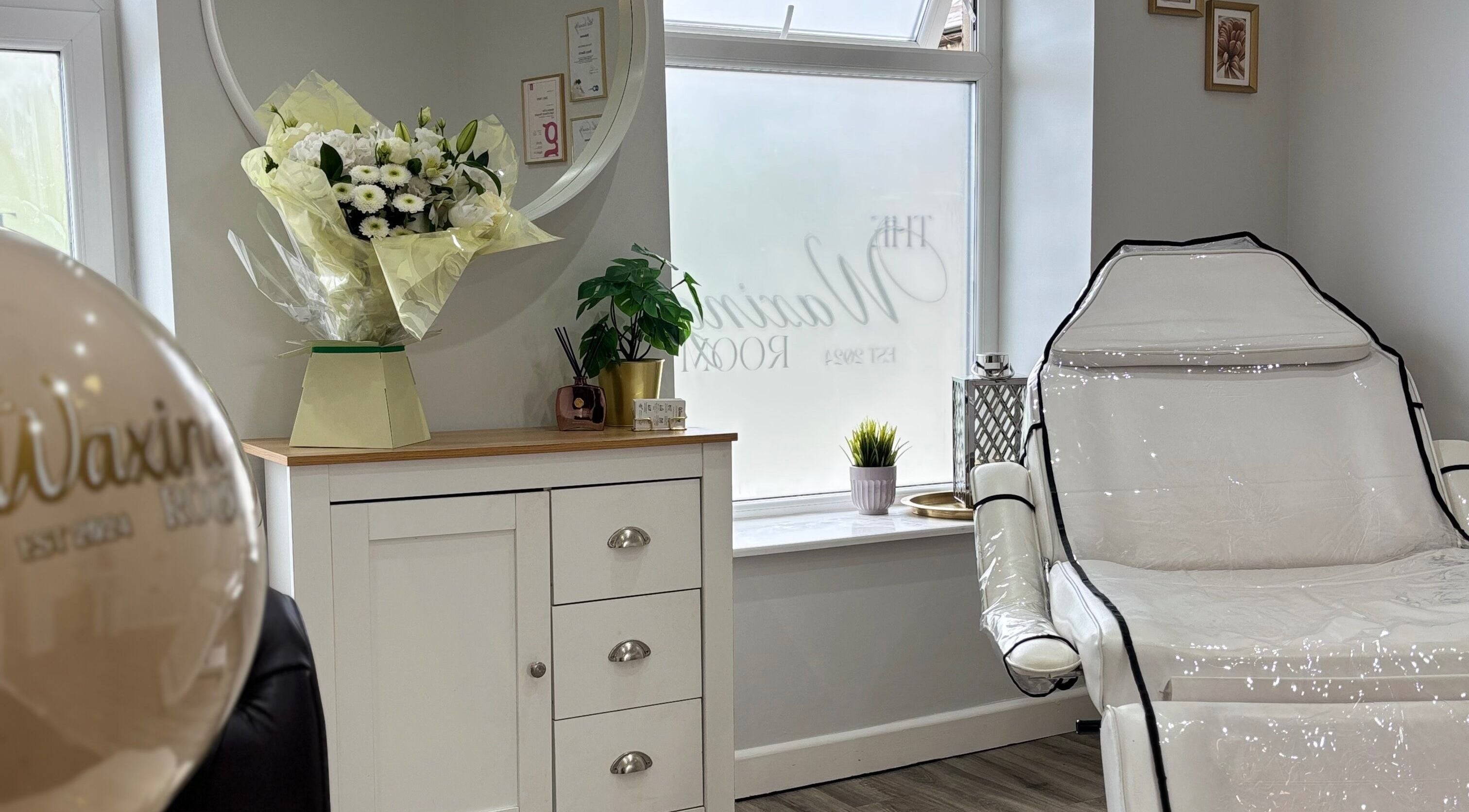 Relaxing treatment room at The Waxing Room in Pencoed, Wales, GB featuring elegant decor and spa chair.