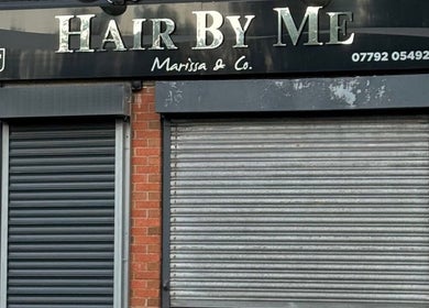 Exterior of The Waxing Room, Pencoed, Wales, GB, showcasing a double-shuttered entrance.