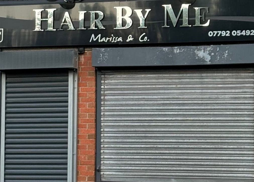 Exterior of The Waxing Room, Pencoed, Wales, GB, showcasing a double-shuttered entrance.