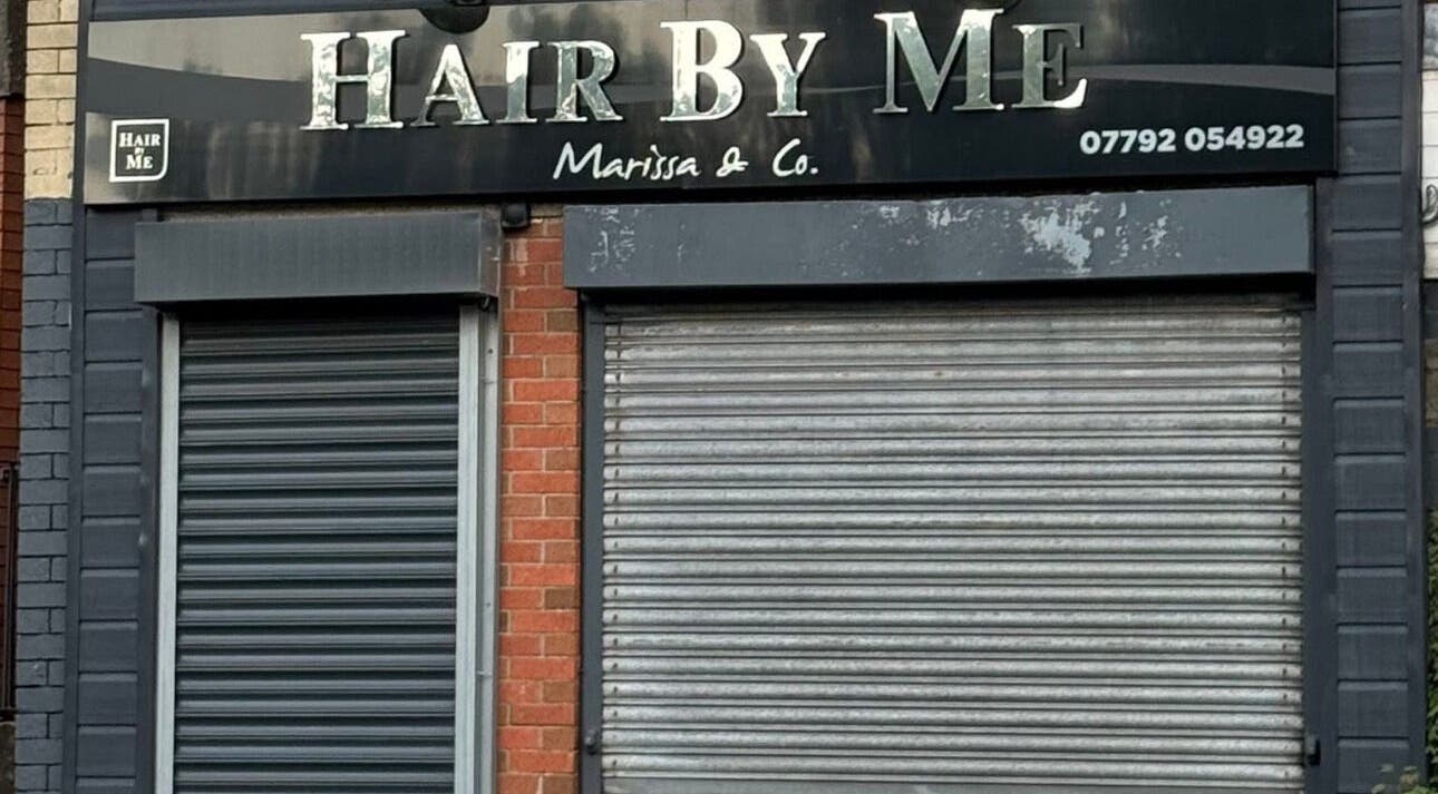 Exterior of The Waxing Room, Pencoed, Wales, GB, showcasing a double-shuttered entrance.