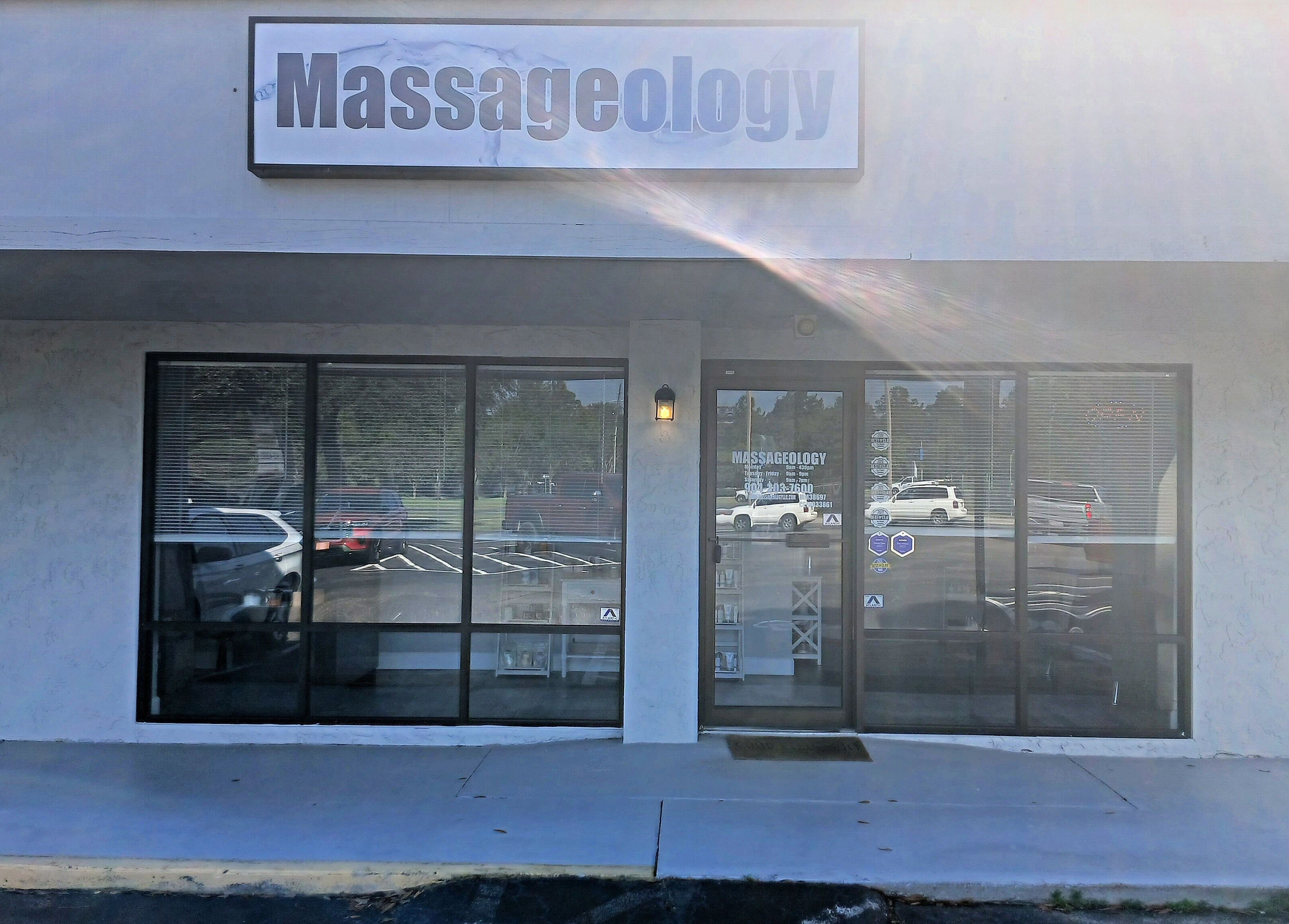 Front entrance of Massageology, Middleburg, Florida, US, showing a welcoming storefront.