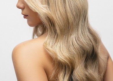 Elegant blonde waves styled at Hope Webley Hairdressing, Perth, Scotland, GB, showcasing salon expertise.