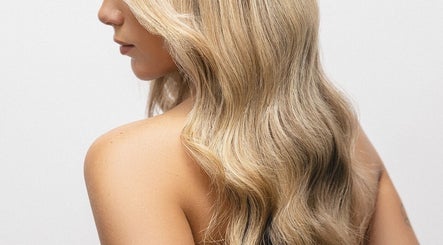 Elegant blonde waves styled at Hope Webley Hairdressing, Perth, Scotland, GB, showcasing salon expertise.