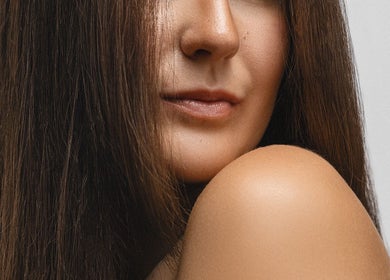 Close-up of a woman with smooth, sleek hair at Hope Webley Hairdressing, Perth, Scotland, GB.