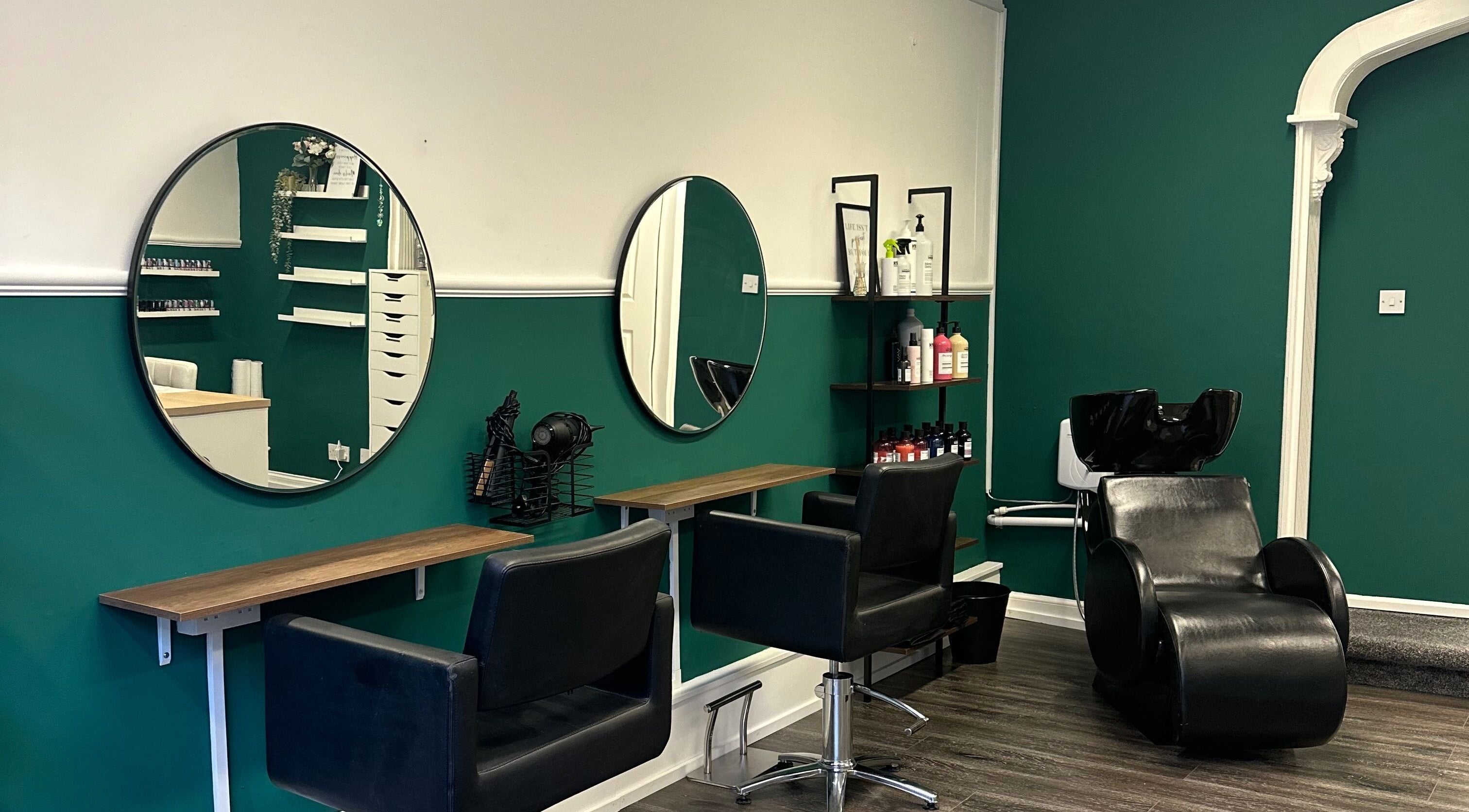 Stylish interior of Hope Webley Hairdressing in Perth, Scotland, GB featuring elegant salon chairs and mirrors.