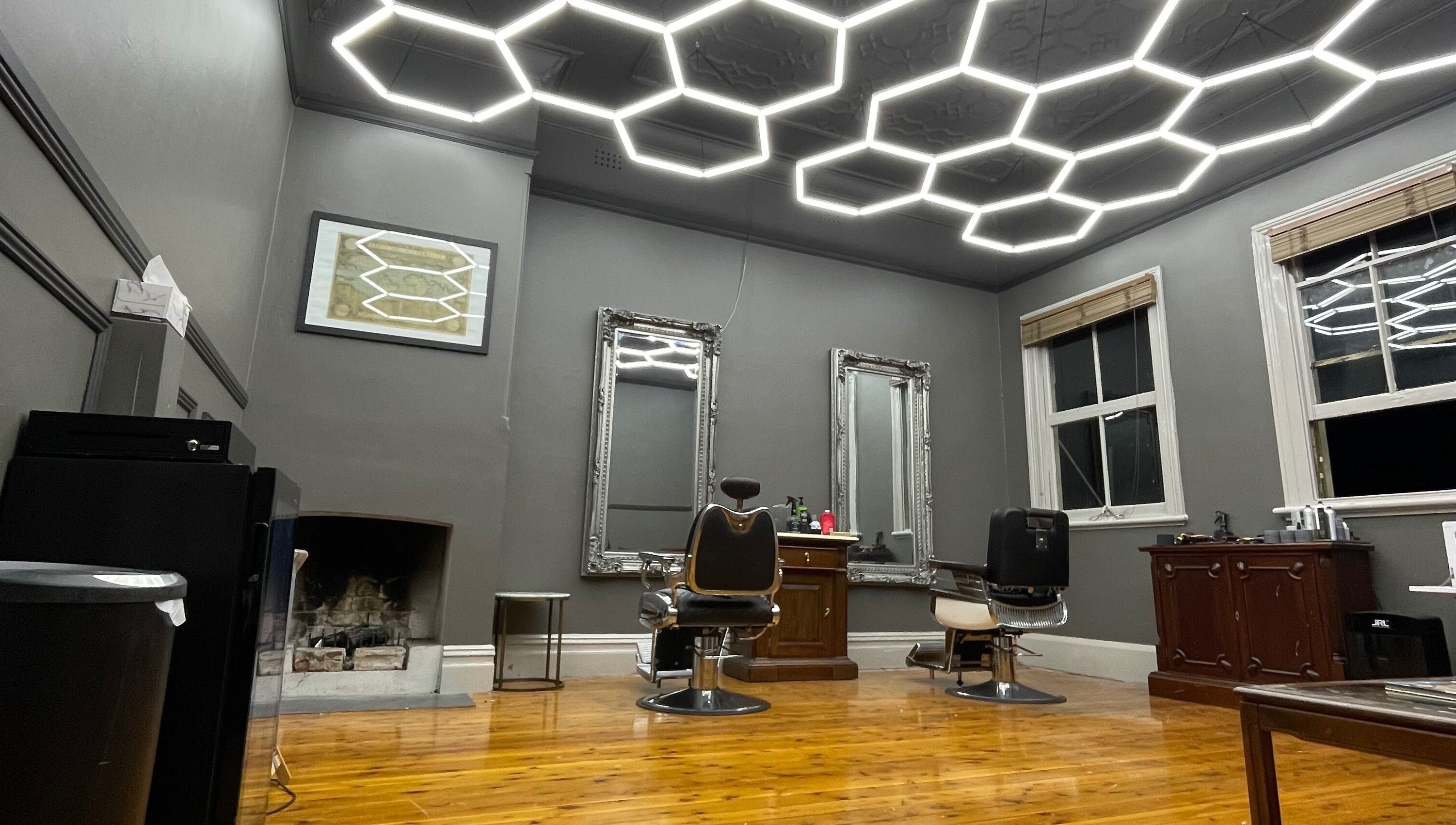 Modern barber chairs and mirrors at Kingdom Barbers & Co., Tamworth, New South Wales, AU.