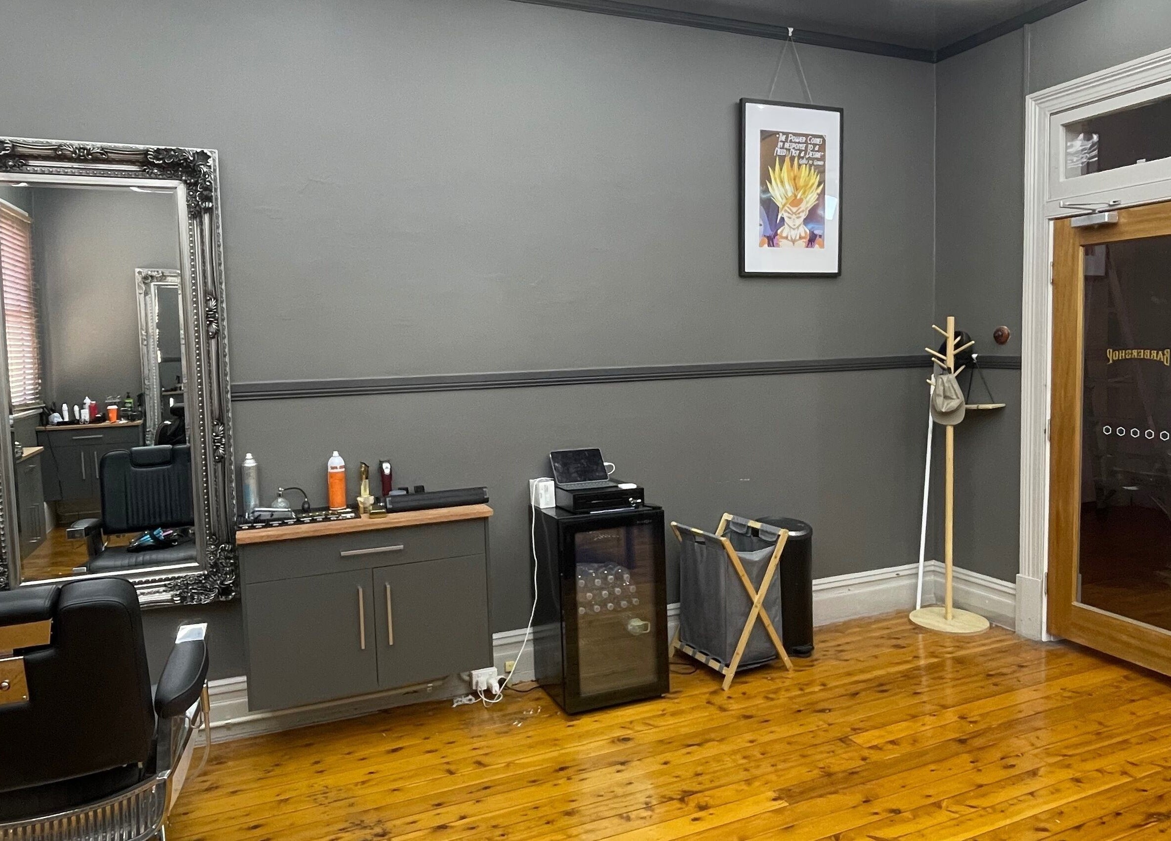 Elegant interior of Kingdom Barbers & Co. in Tamworth, New South Wales. Classic styling chair and mirror.