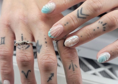 Elegant nail art with blue and white shell design at Solis Vita Spa.Michelle, St. Thomas, Ontario, CA.