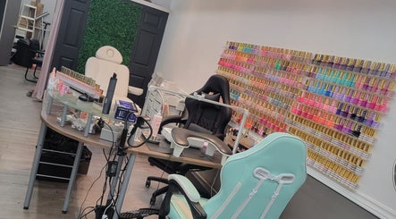 A vibrant nail salon setup at Solis Vita Spa.Michelle in St. Thomas, Ontario, CA, showcasing colorful nail polish racks.