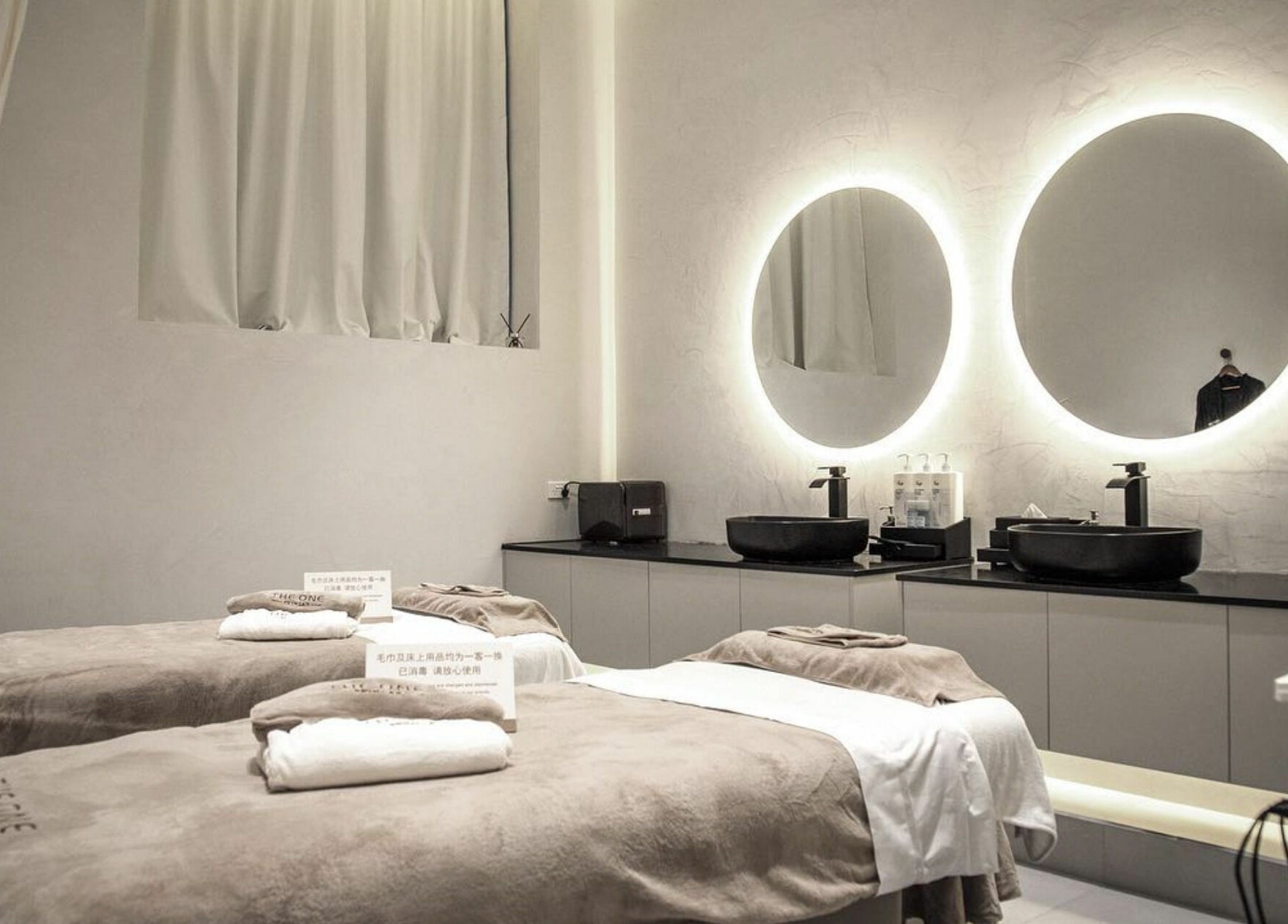 Tranquil spa room at The One Skin Lab - QVB, Sydney, New South Wales, AU with two massage beds.