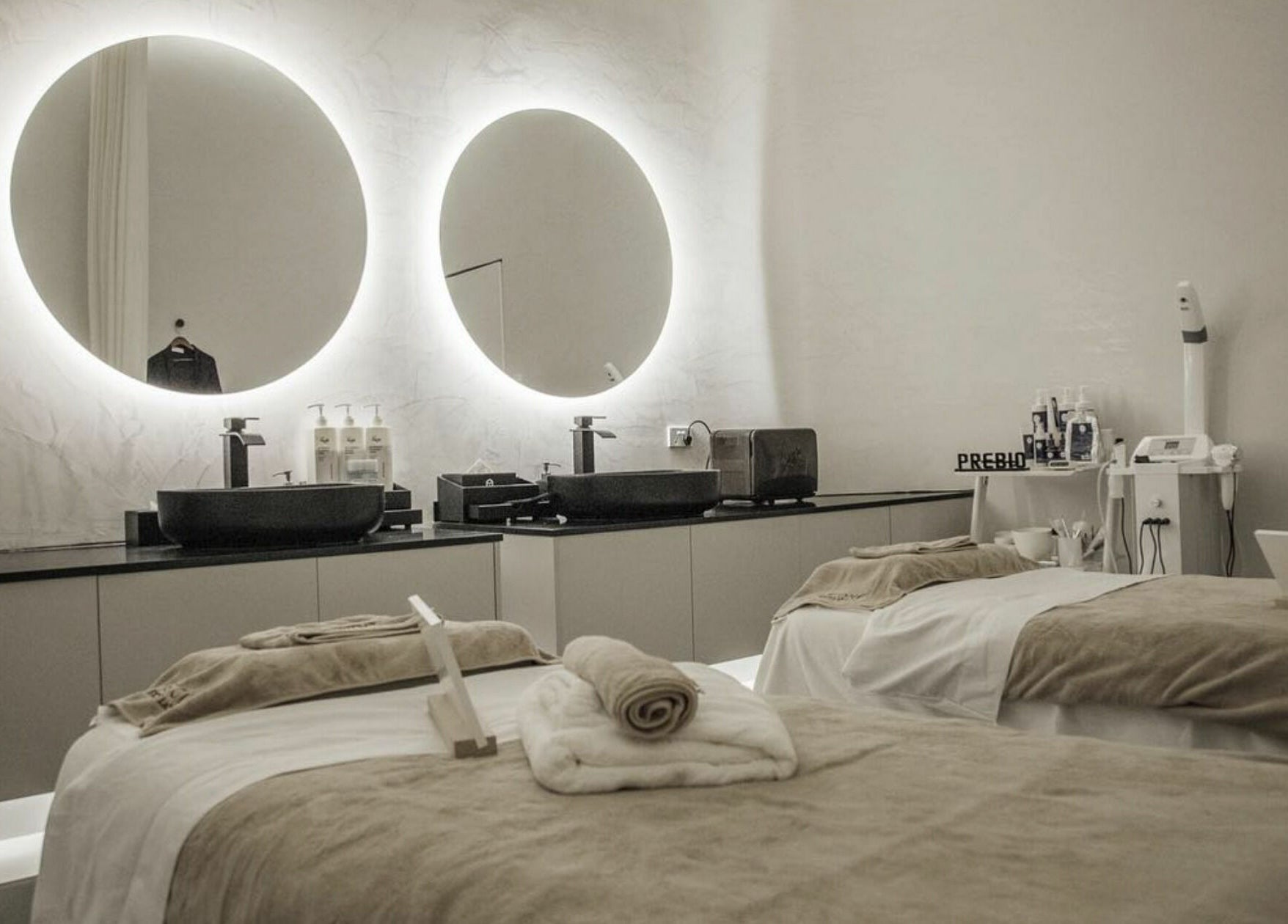 Luxurious treatment room at The One Skin Lab - QVB, Sydney, New South Wales, AU with illuminated mirrors.
